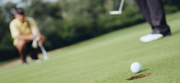 2 Men are Playing Golf